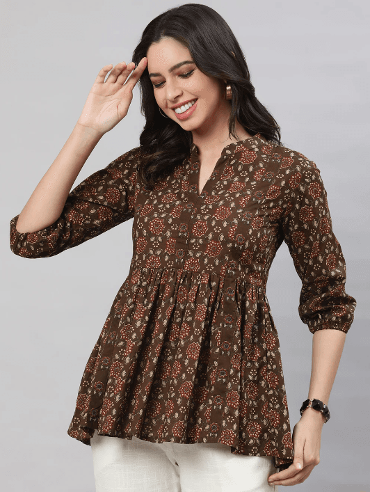 Woman wearing a brown indian kurti for women by Nishtha Chadda