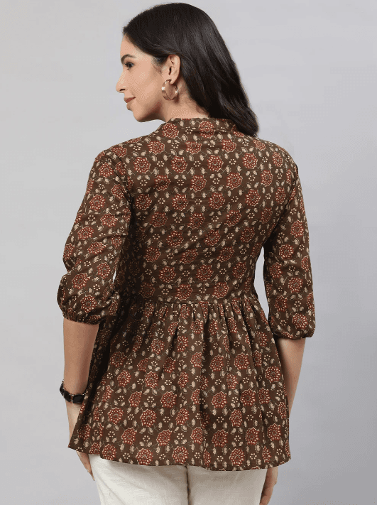 Woman wearing a brown indian kurti for women by Nishtha Chadda