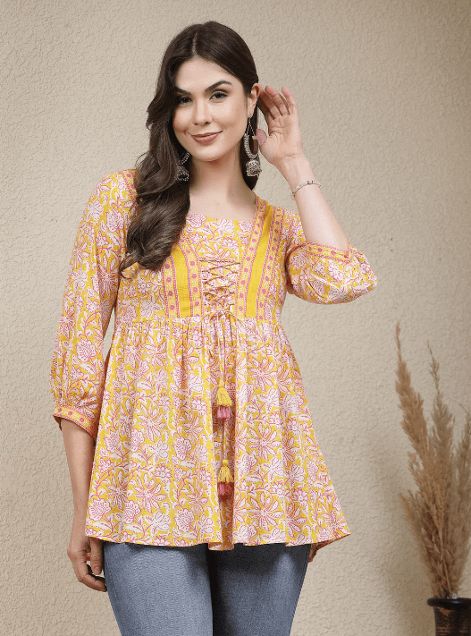 Woman wearing a grey indian kurti for women by Nishtha Chadda