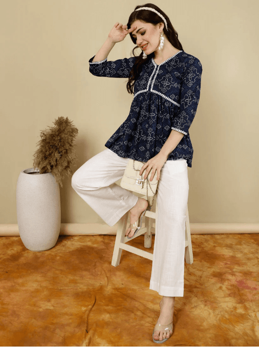 Woman wearing a brown indian kurti for women by Nishtha Chadda