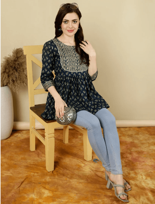 Woman wearing a brown indian kurti for women by Nishtha Chadda