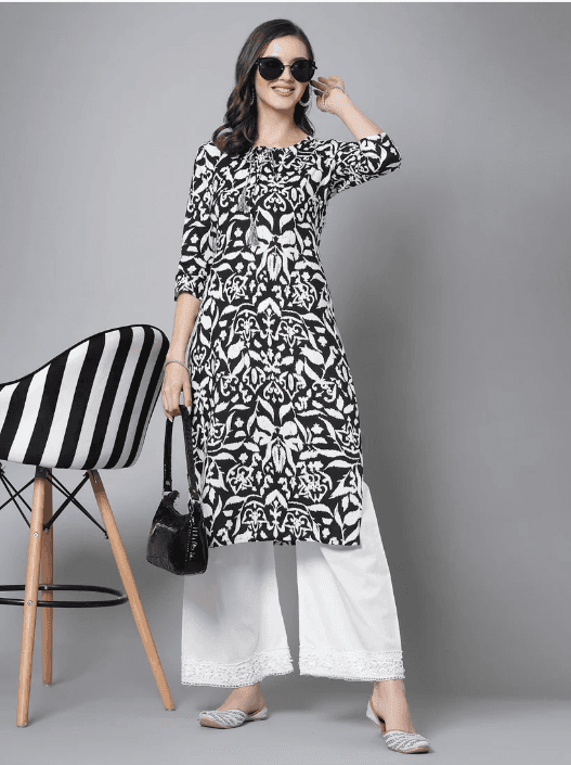 Woman wearing a grey indian kurti for women by Nishtha Chadda