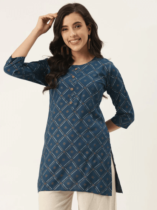 Woman wearing a olive indian kurti for women by Nishtha Chadda