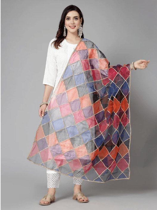 Woman wearing a brown indian kurti for women by Nishtha Chadda