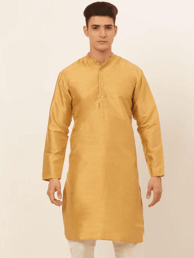 Model wearing a mustard party wear kurta by Nishtha Chadda
