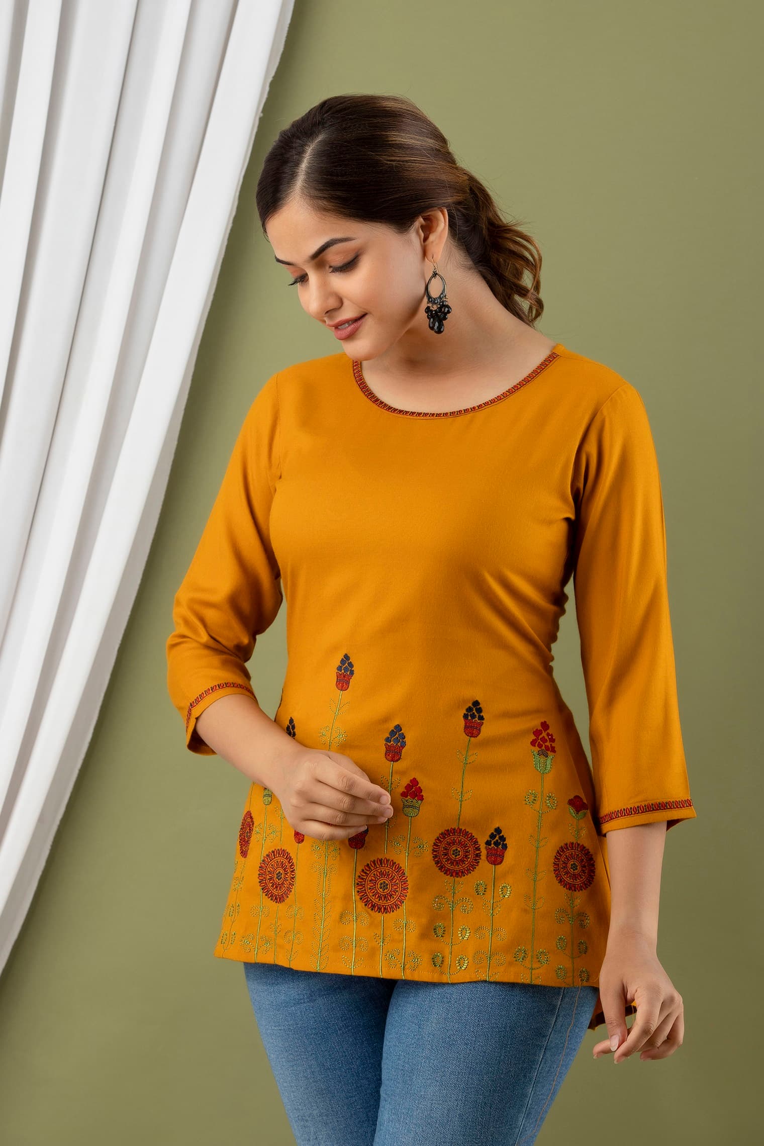 Woman wearing a brown indian kurti for women by Nishtha Chadda