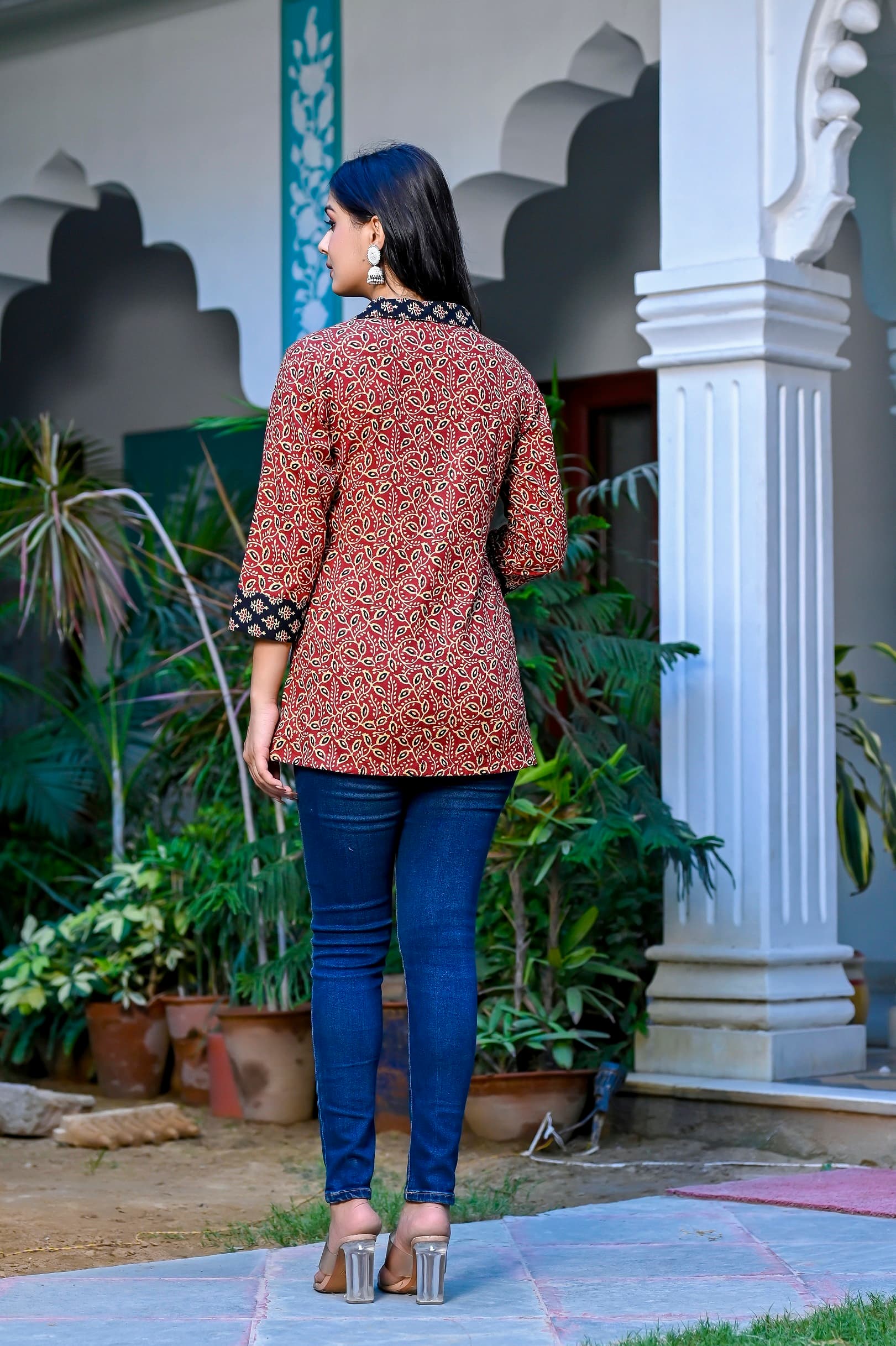 Woman wearing a navy kurti set with dupatta by Nishtha Chadda