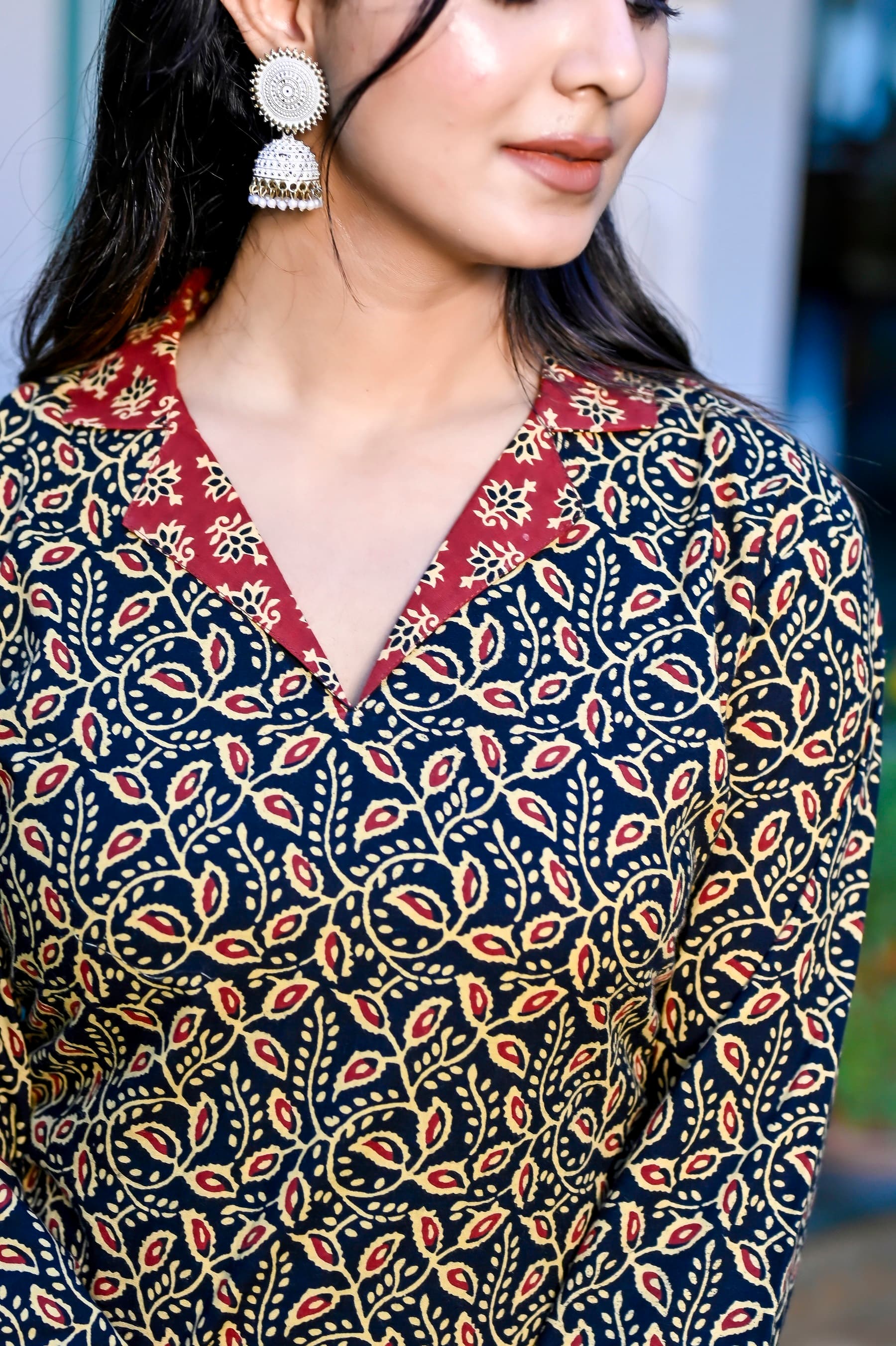 Woman wearing a navy kurti set with dupatta by Nishtha Chadda