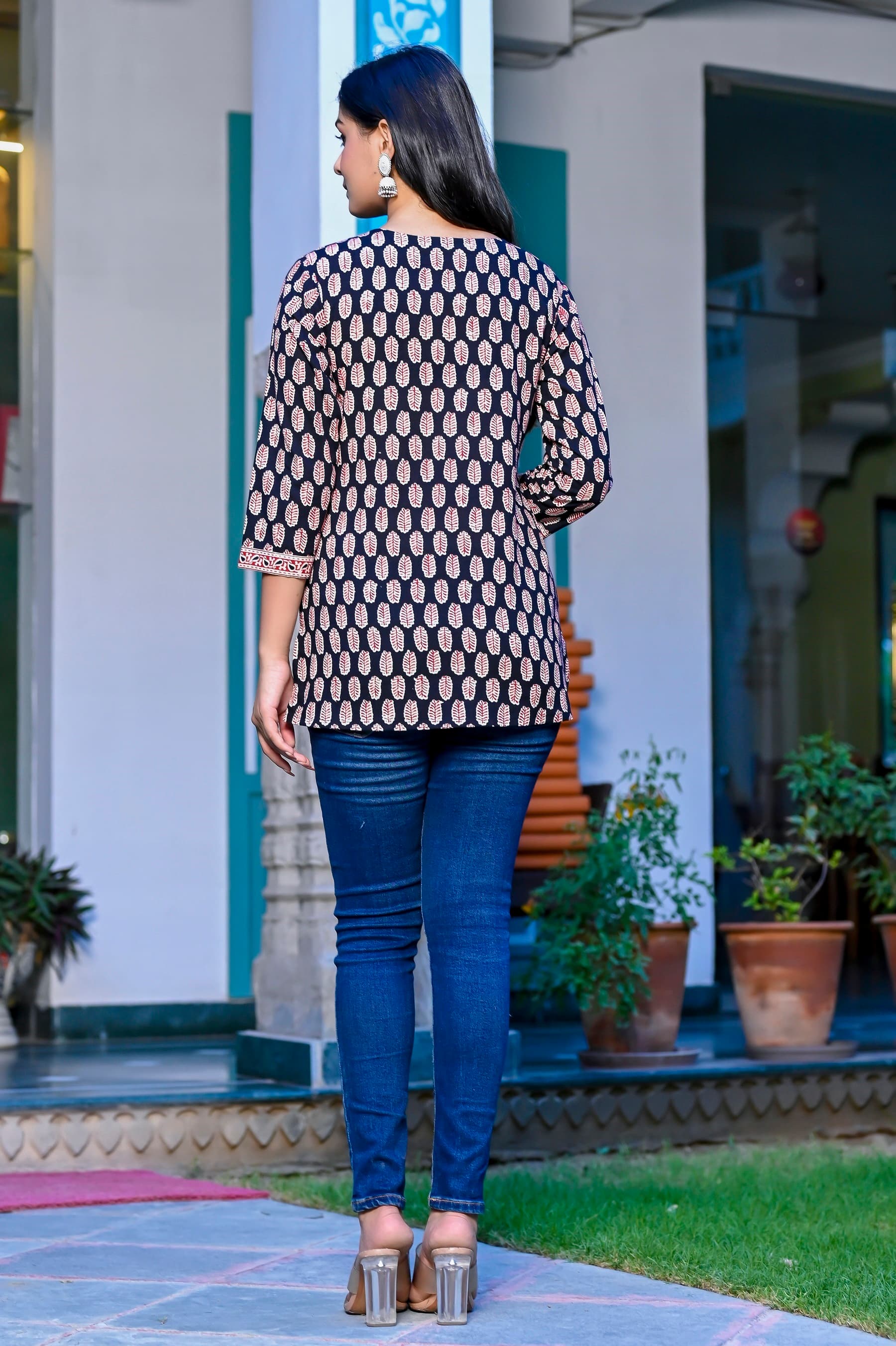 Woman wearing a navy kurti set with dupatta by Nishtha Chadda