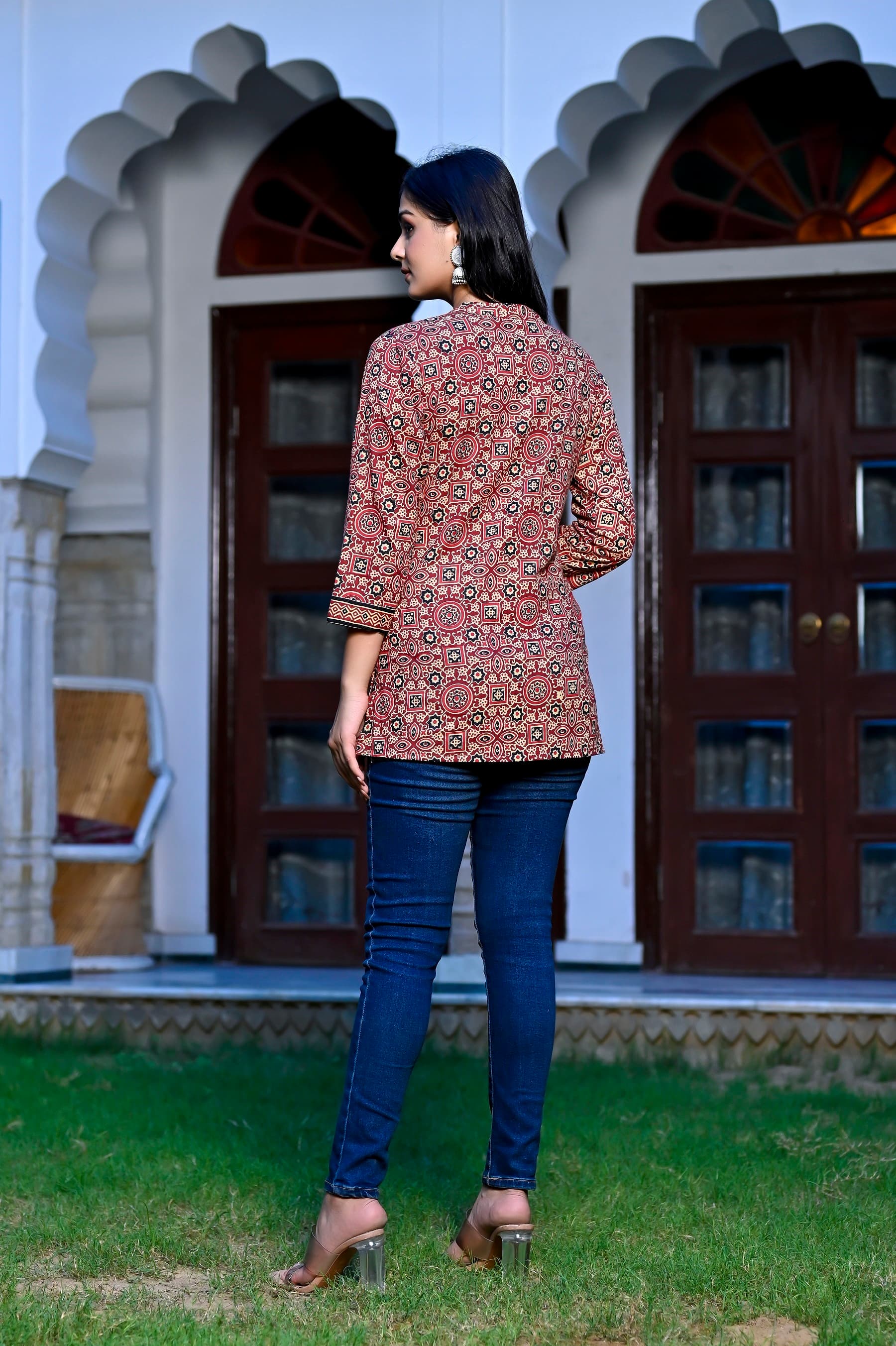 Woman wearing a black kurti set with dupatta by Nishtha Chadda