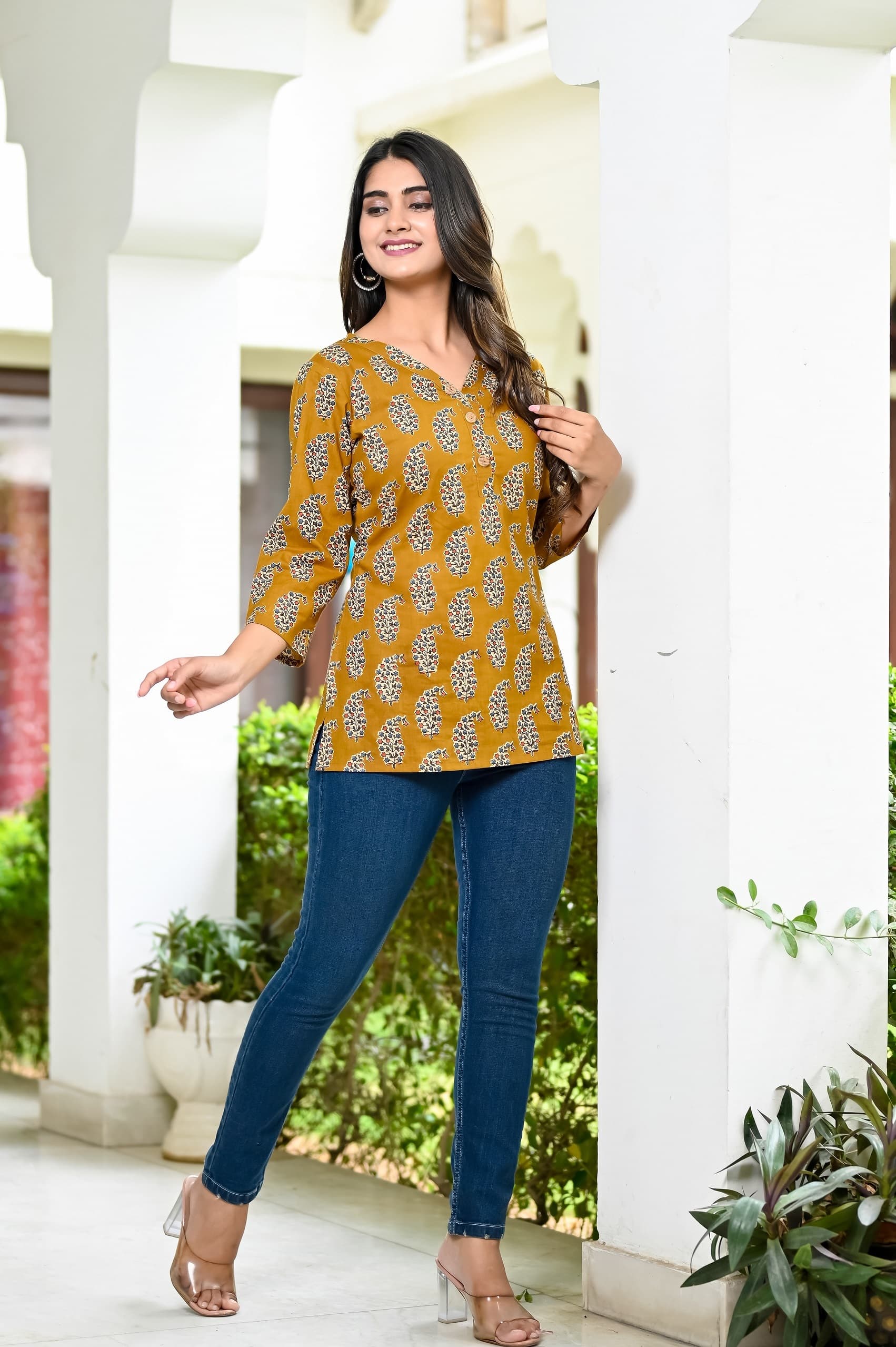 Woman wearing a olive kurti set with dupatta by Nishtha Chadda